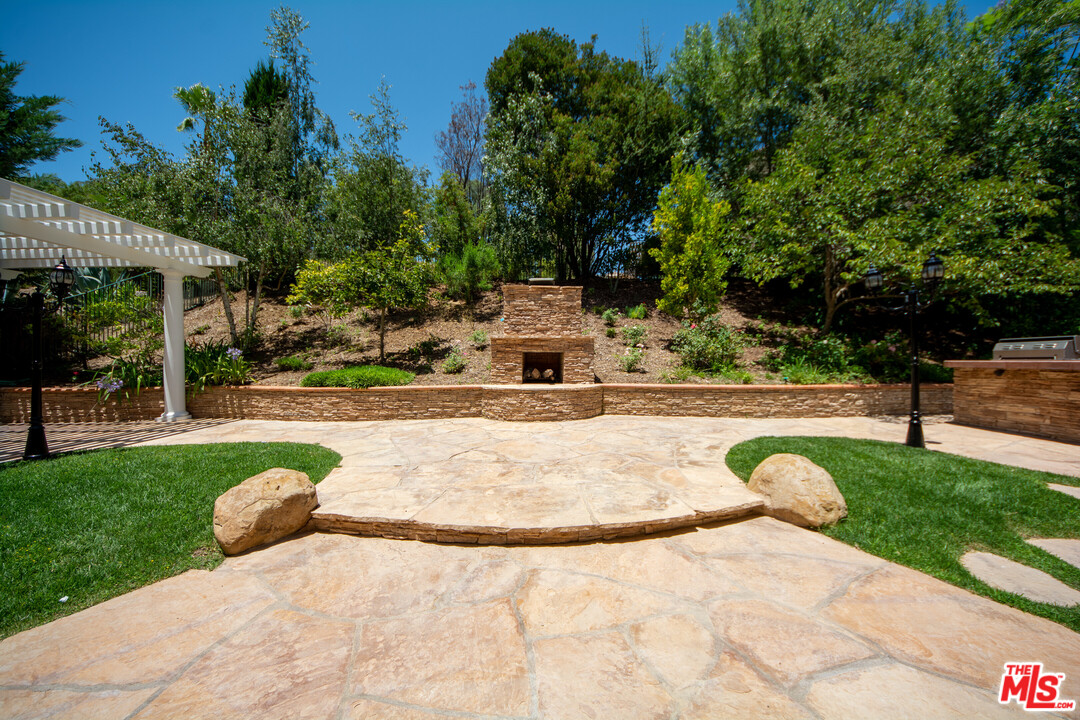 149 Laurel Ridge Drive Simi Valley, CA 93065 - Photo 25 of 53 a view of a swimming pool with a patio and a yard