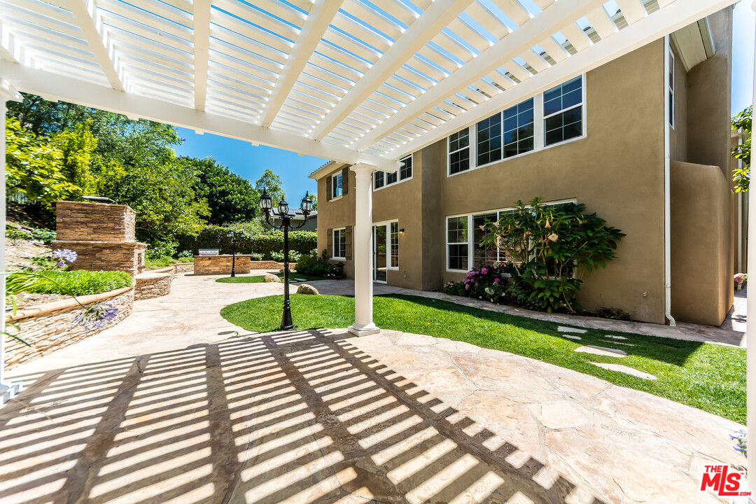 149 Laurel Ridge Drive Simi Valley, CA 93065 - Photo 27 of 53 a view of a patio with table and chairs and potted plants