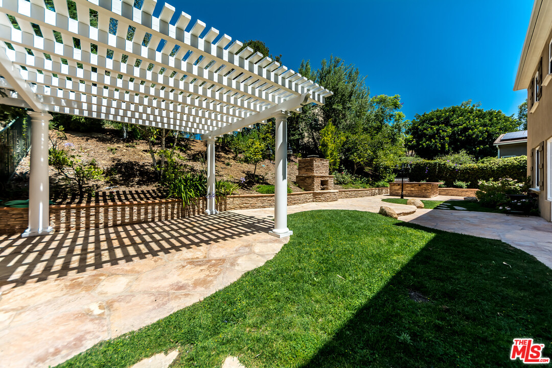 149 Laurel Ridge Drive Simi Valley, CA 93065 - Photo 28 of 53 a view of a porch with a garden