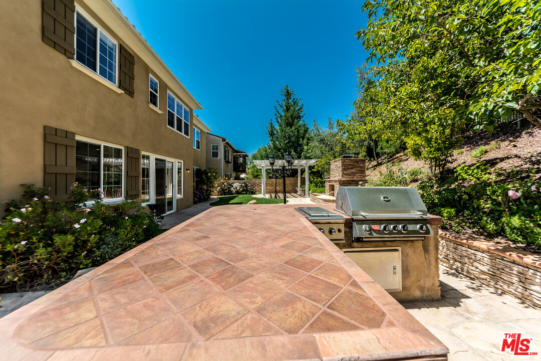 149 Laurel Ridge Drive Simi Valley, CA 93065 - Photo 29 of 53 a house with trees in front of it