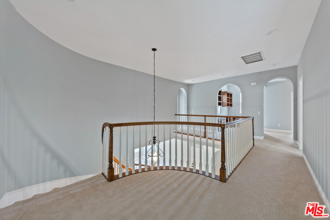 149 Laurel Ridge Drive Simi Valley, CA 93065 - Photo 31 of 53 a view of a hallway with staircase