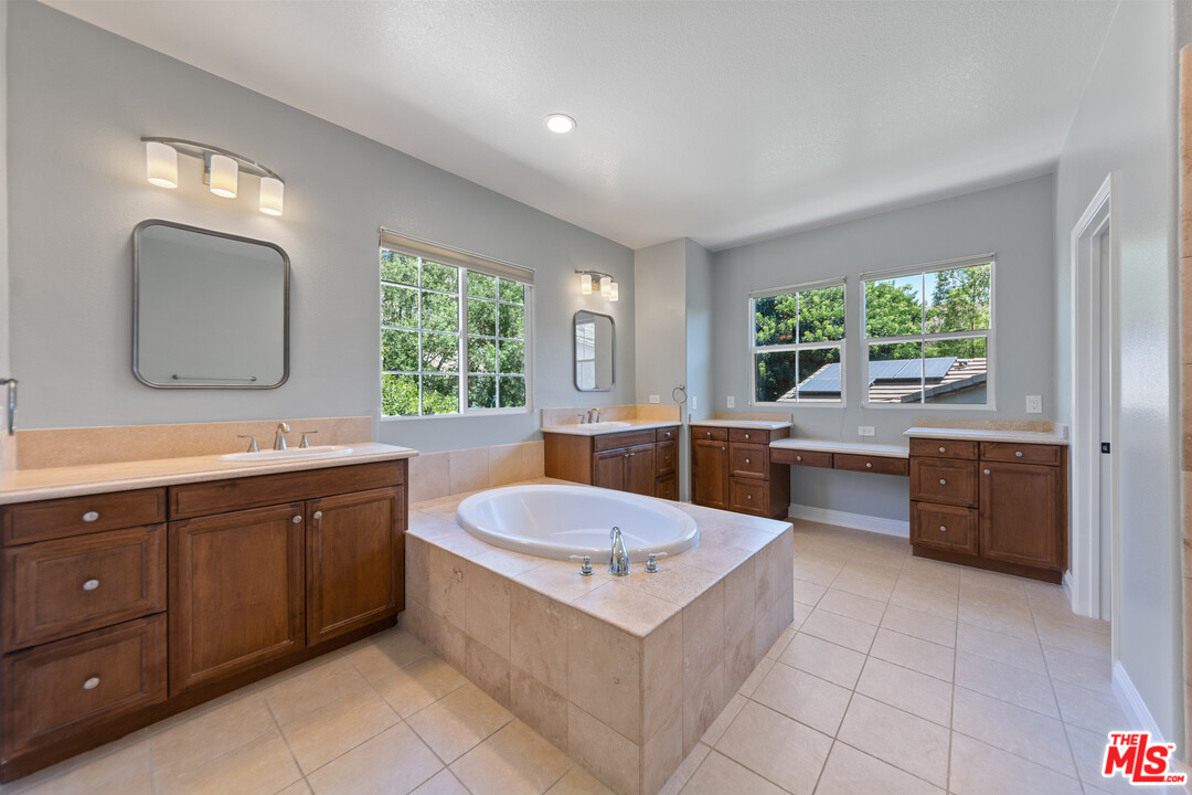 149 Laurel Ridge Drive Simi Valley, CA 93065 - Photo 36 of 53 a bathroom with a tub sink and mirror