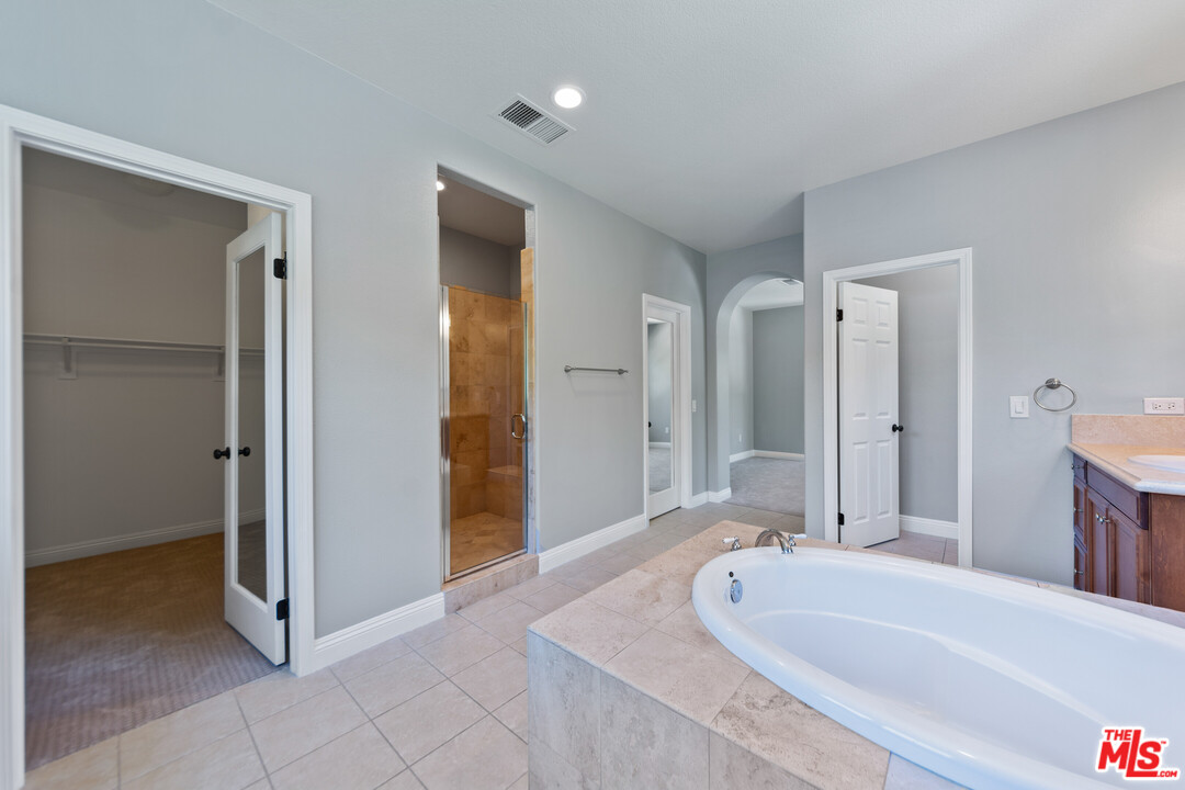 149 Laurel Ridge Drive Simi Valley, CA 93065 - Photo 38 of 53 a spacious bathroom with a tub shower and sink