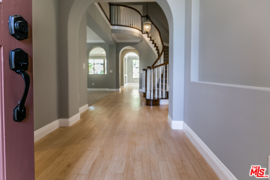 149 Laurel Ridge Drive Simi Valley, CA 93065 - Photo 5 of 53 a view of a hallway with wooden floor
