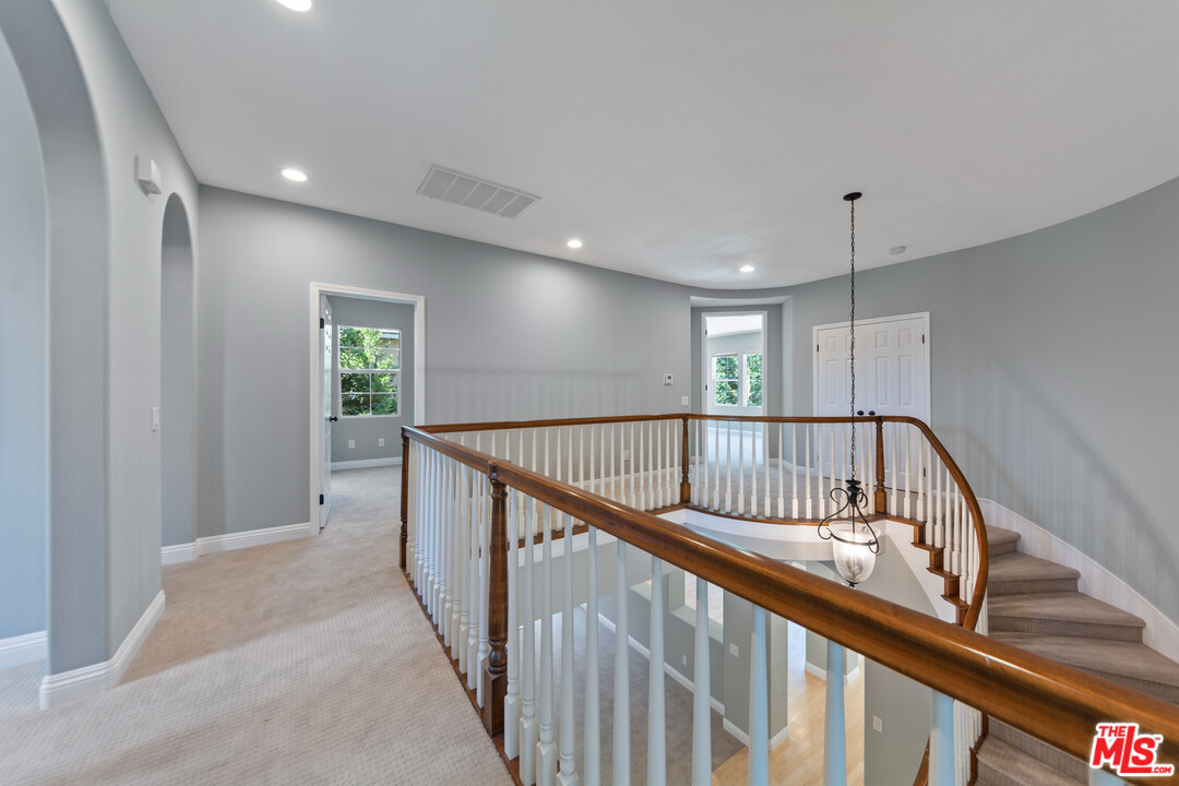 149 Laurel Ridge Drive Simi Valley, CA 93065 - Photo 42 of 53 a view of staircase with wooden floor and fan
