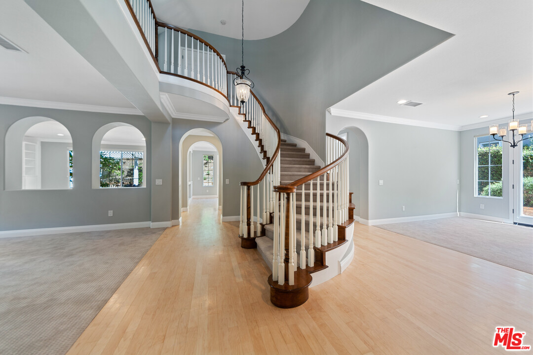149 Laurel Ridge Drive Simi Valley, CA 93065 - Photo 8 of 53 a view of a hallway with entryway wooden floor and front door