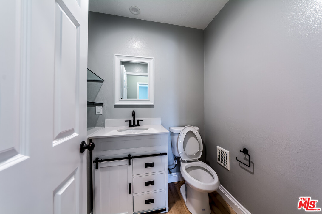 149 Laurel Ridge Drive Simi Valley, CA 93065 - Photo 9 of 53 a bathroom with a sink toilet and a mirror