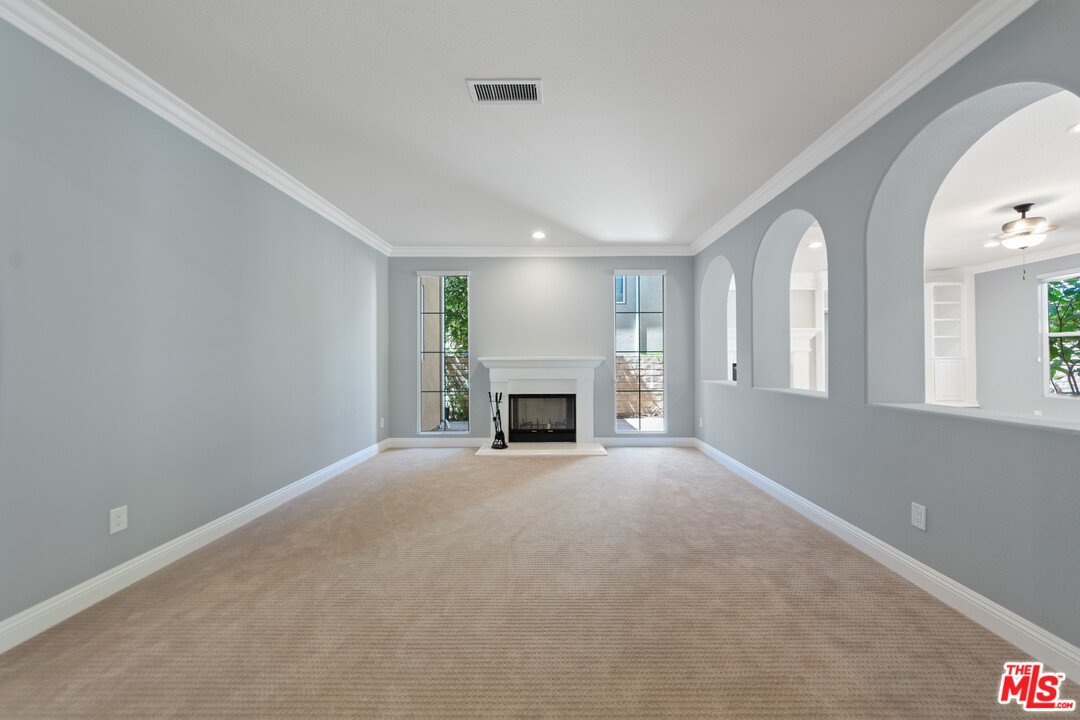 149 Laurel Ridge Drive Simi Valley, CA 93065 - Photo 10 of 53 a view of an empty room with a fireplace and a window