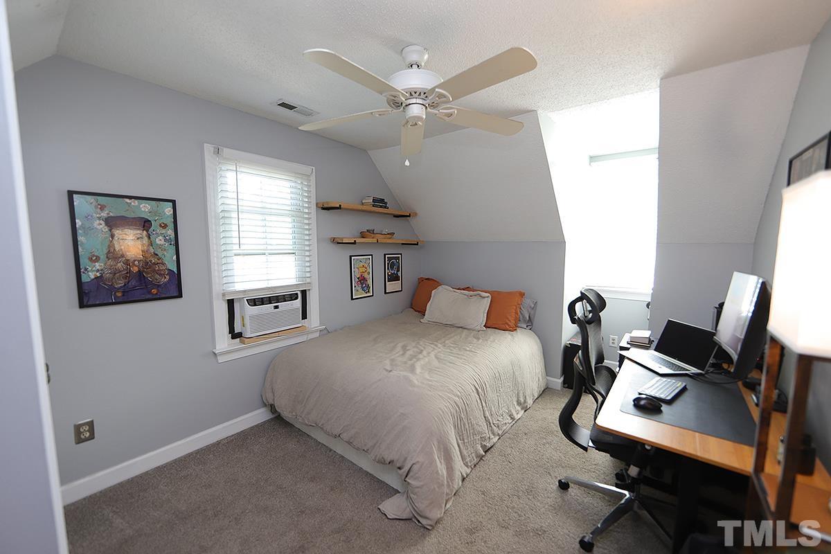 3301 East Jameson Road Raleigh, NC 27604 - Photo 19 of 29 a bed room with a bed and a window