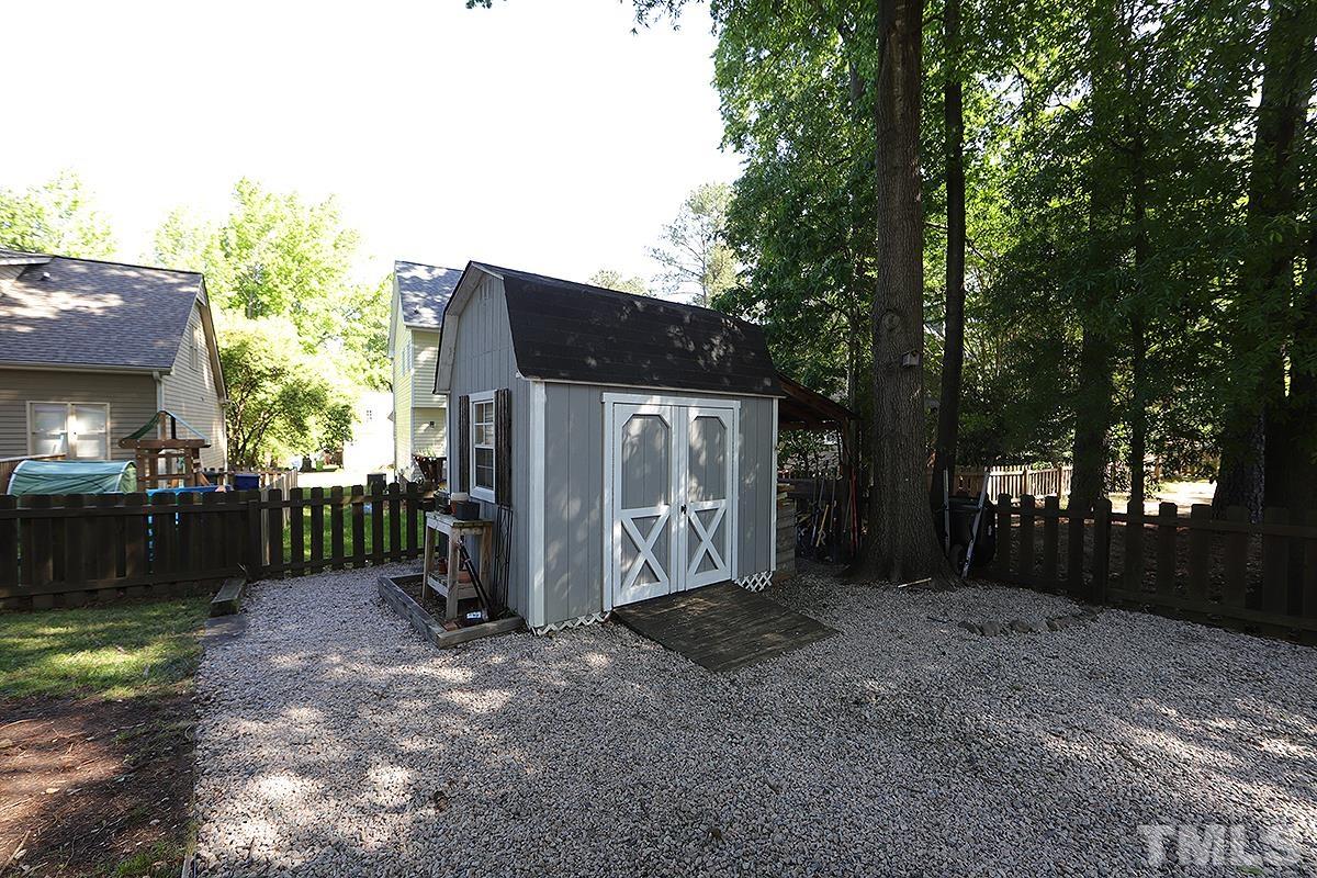 3301 East Jameson Road Raleigh, NC 27604 - Photo 25 of 29 a front view of a house with a yard