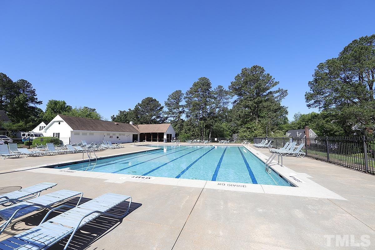 3301 East Jameson Road Raleigh, NC 27604 - Photo 26 of 29 a view of a tennis ground with large trees