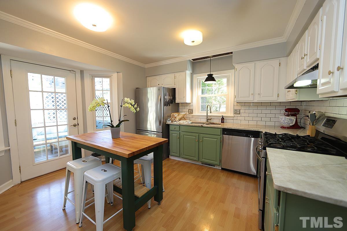 3301 East Jameson Road Raleigh, NC 27604 - Photo 8 of 29 a kitchen with granite countertop lots of counter top space and stainless steel appliances