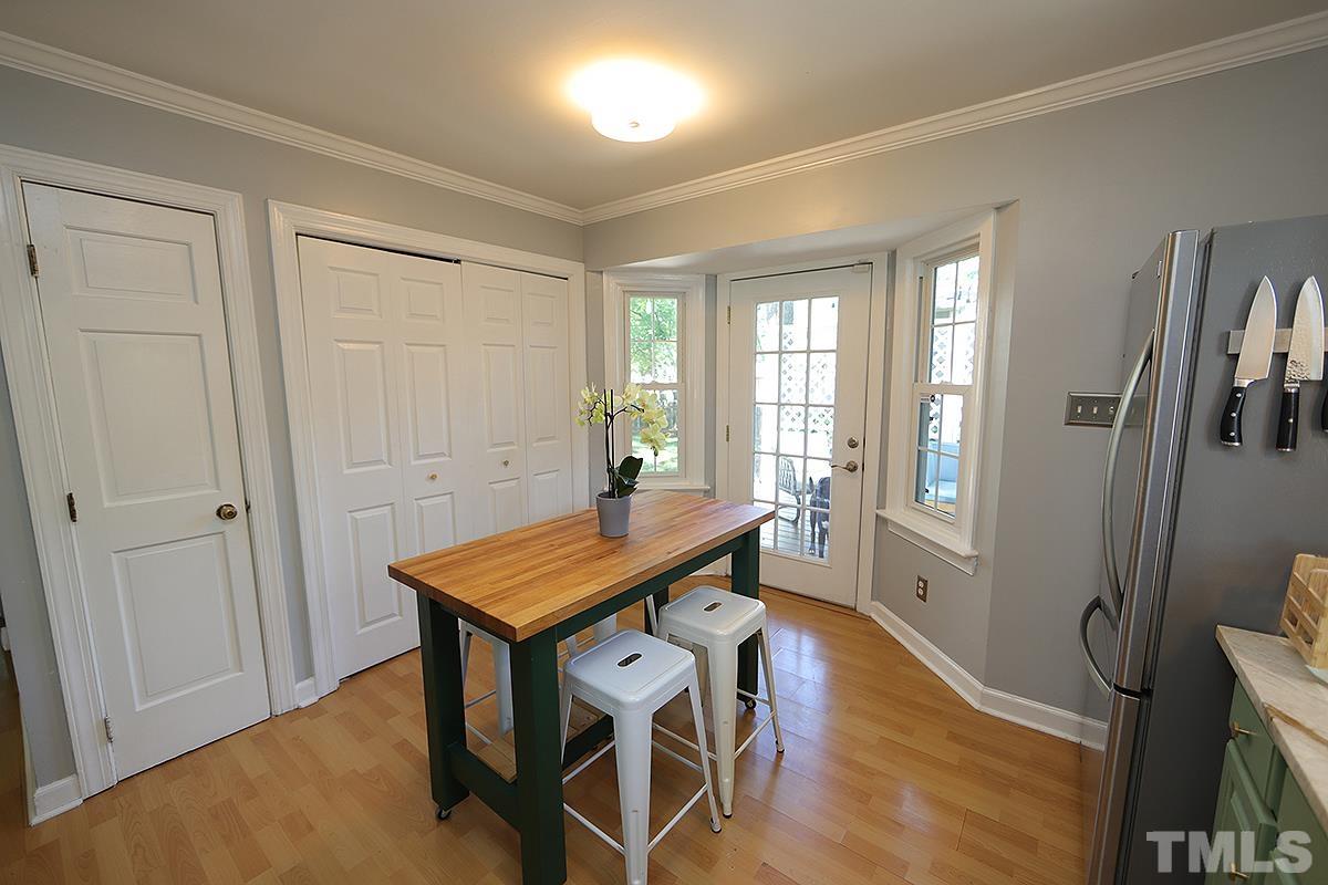 3301 East Jameson Road Raleigh, NC 27604 - Photo 10 of 29 a view of a room with furniture window and wooden floor