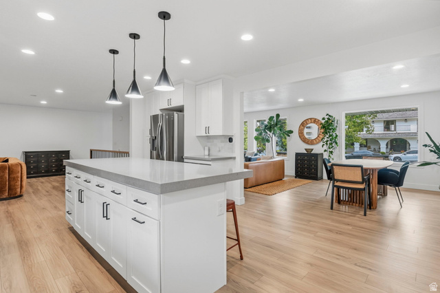 4150 Dover Lane Provo, UT 84604 - Photo 13 of 44 Spacious open-concept interior featuring light wood-finish flooring throughout