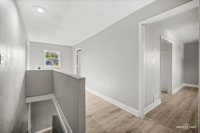 a view of livingroom with hardwood and hallway