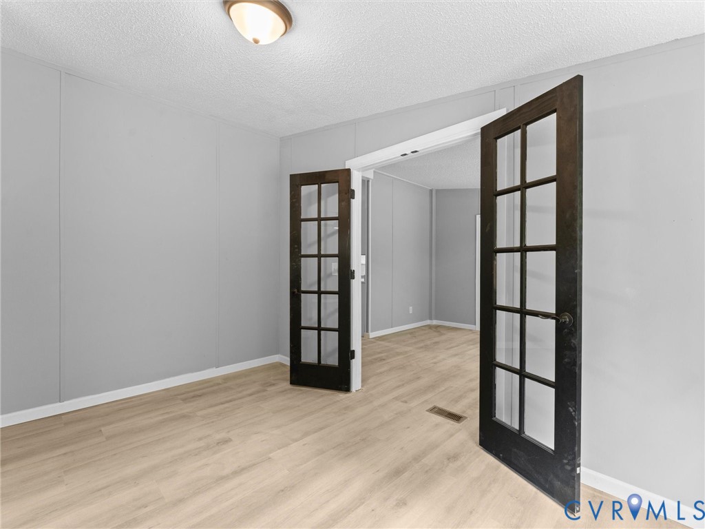 1909 Neves Road Beaverdam, VA 23015 - Photo 22 of 48 Light wood-finish flooring, neutral gray wall tone