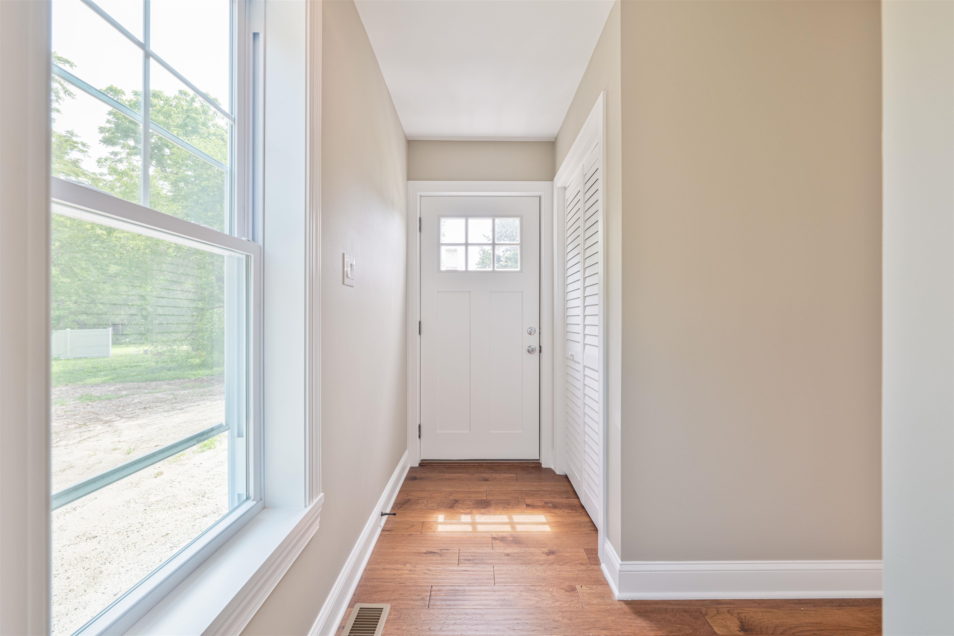 157 Fishing Creek Road North Cape May, NJ 08204 - Photo 18 of 50 a view of a hallway with wooden floor and windows