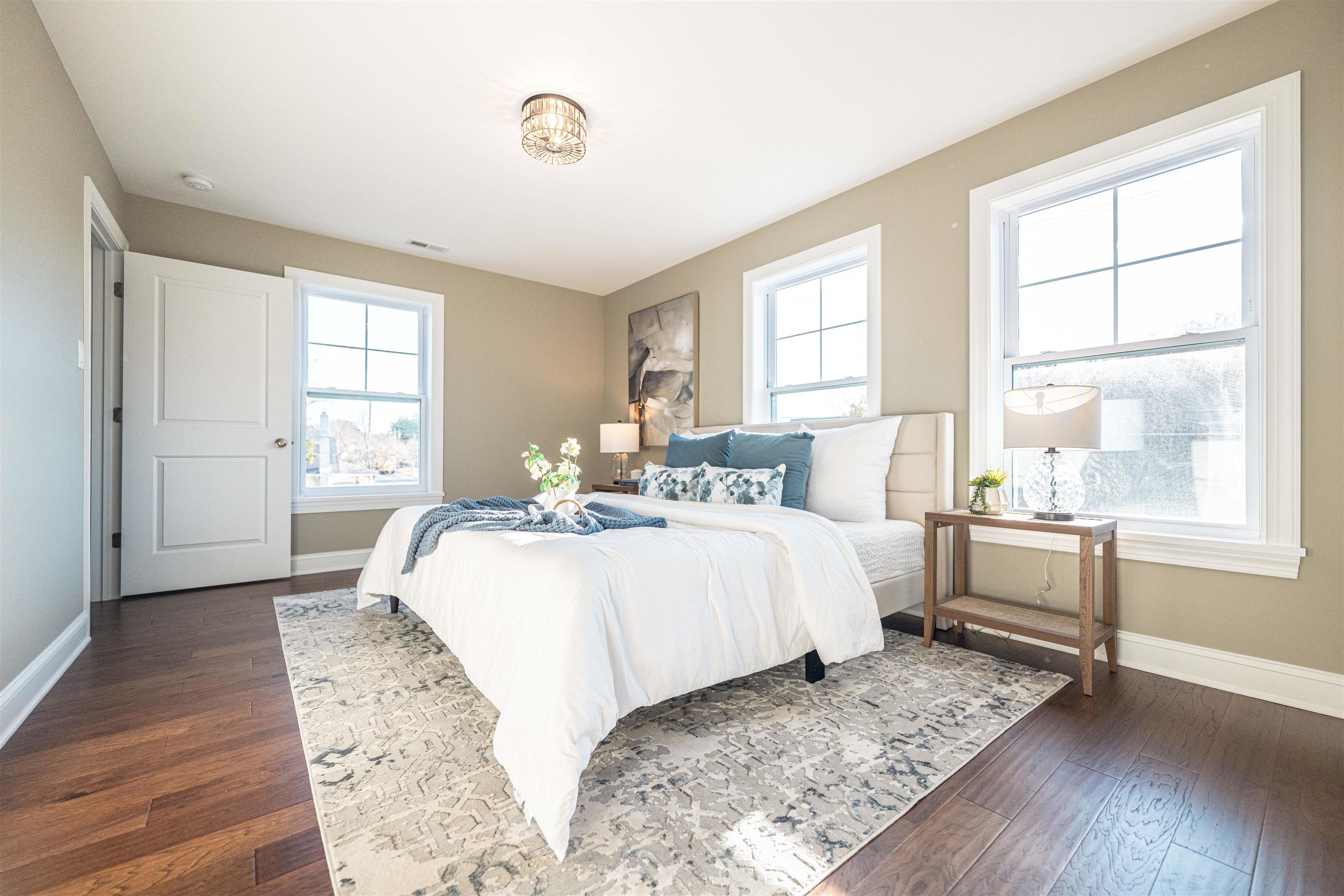 157 Fishing Creek Road North Cape May, NJ 08204 - Photo 26 of 50 a spacious bedroom with a bed and wooden floor