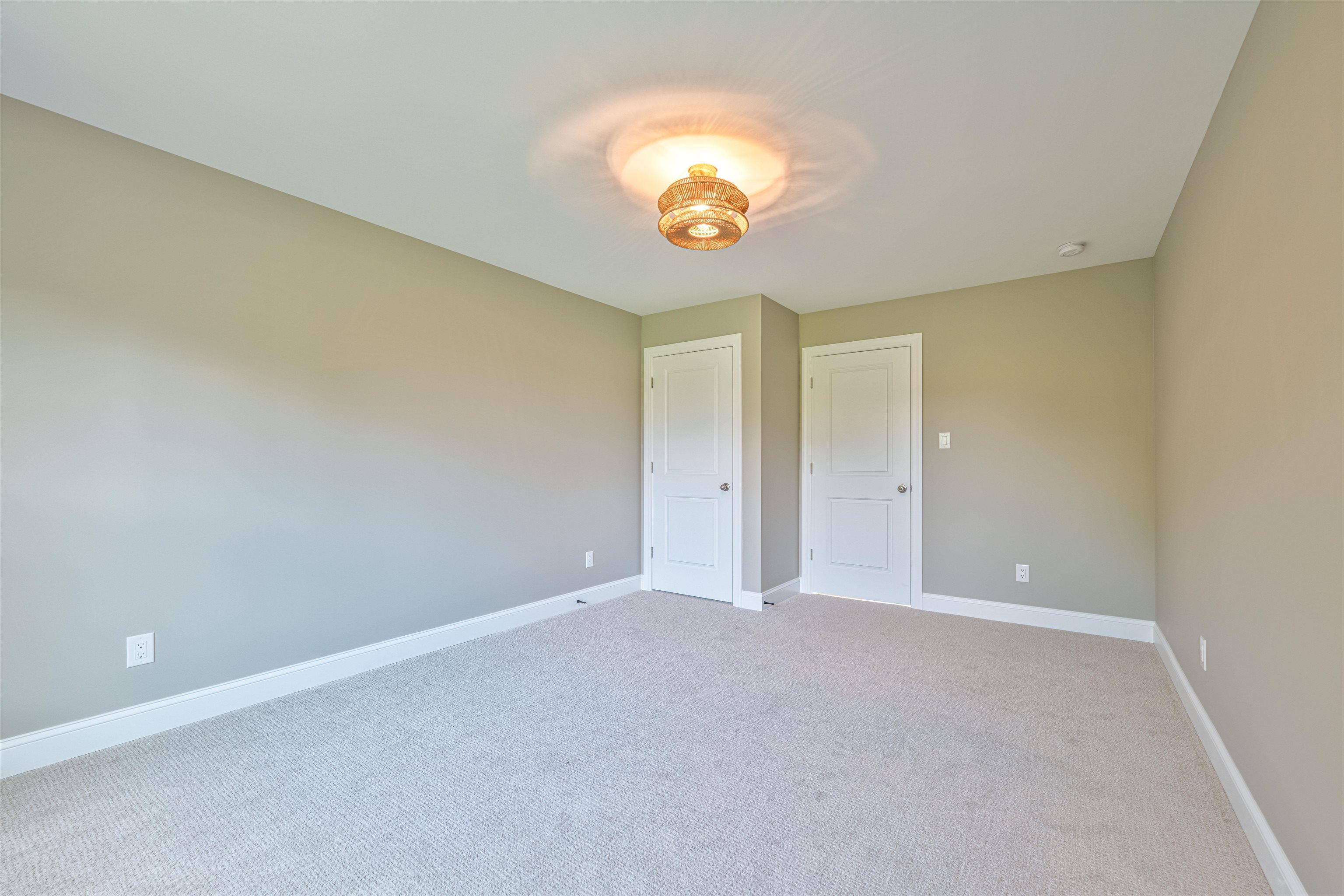 157 Fishing Creek Road North Cape May, NJ 08204 - Photo 29 of 50 an empty room with a chandelier fan and a window