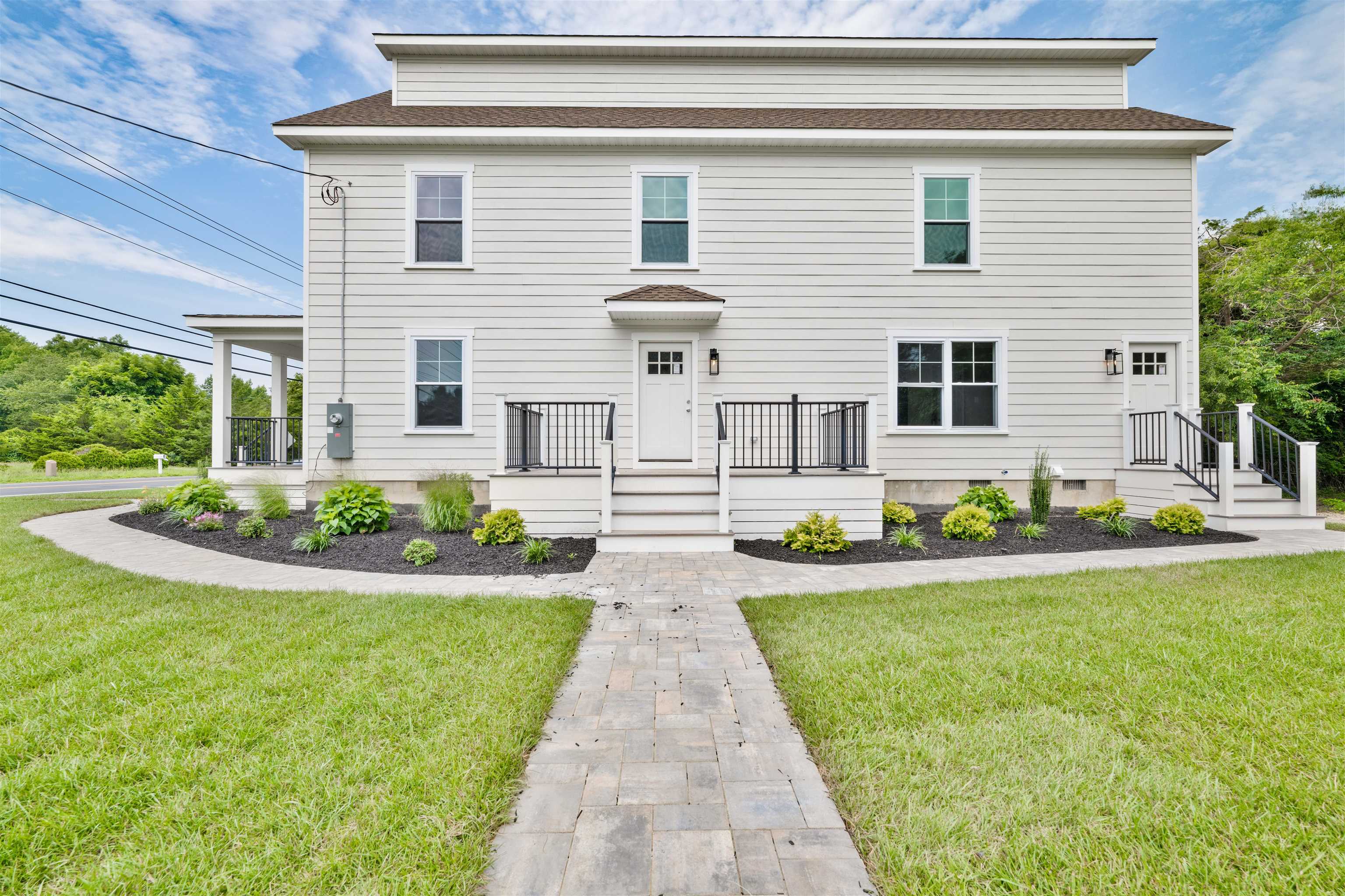 157 Fishing Creek Road North Cape May, NJ 08204 - Photo 42 of 50 a front view of a house with garden and porch