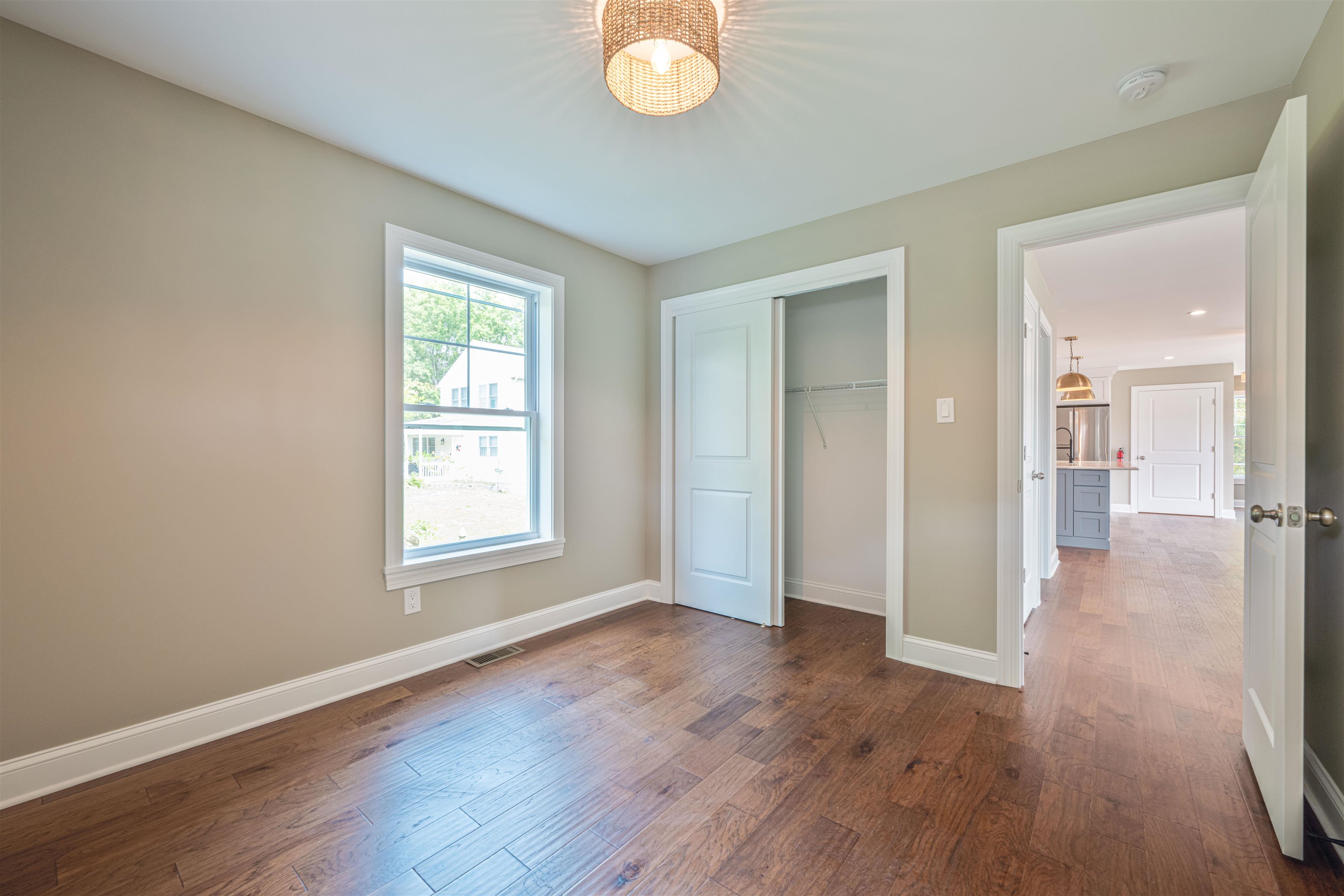 157 Fishing Creek Road North Cape May, NJ 08204 - Photo 6 of 50 an empty room with wooden floor and windows