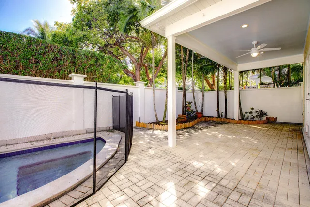 a view of a porch with wooden floor and fence