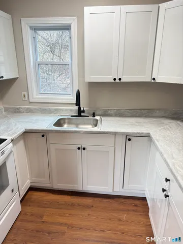 a view of cabinets with wooden floor