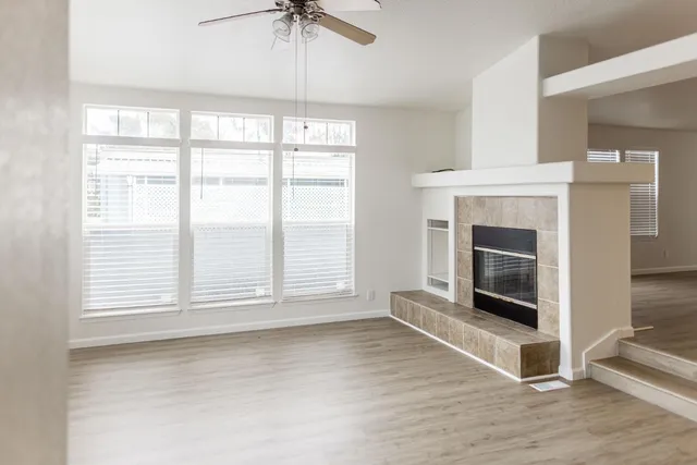 a kitchen with stainless steel appliances granite countertop wooden cabinets and a stove top oven