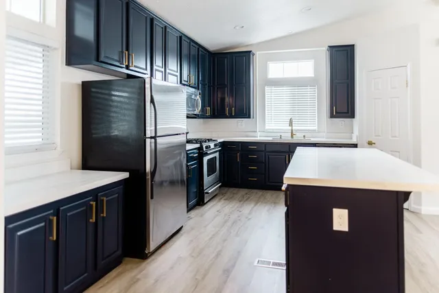 a view of a sink with a washer and dryer