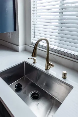 a view of an empty room with a fireplace