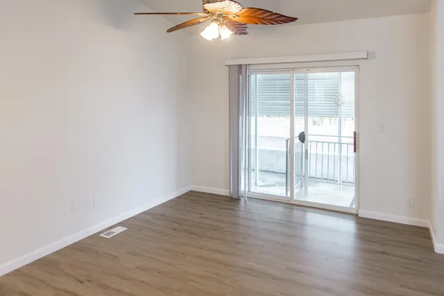 a view of a hallway with closet and utility room