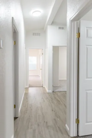 a bathroom with bathtub and window