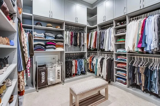 a view of a livingroom with workspace and a couch