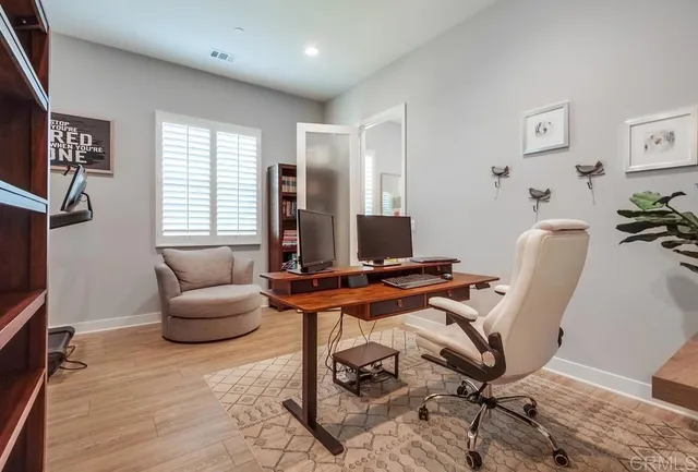 a bathroom with a granite countertop shower a toilet and a sink