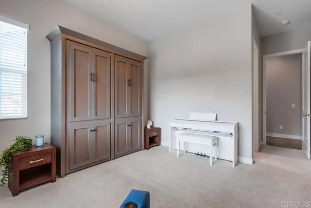 a view of an outdoor dining space with a table and chairs