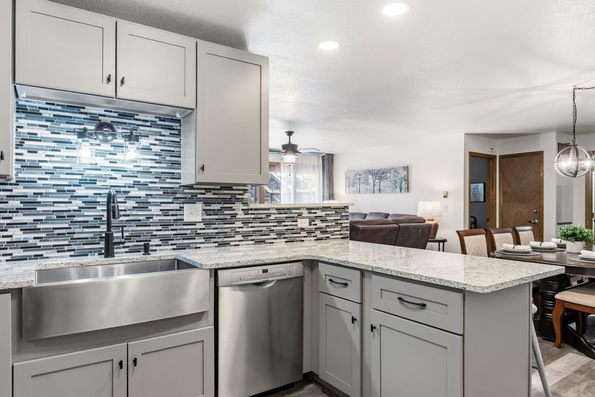 89410 Ryan Gulch Road, Unit 208 Silverthorne, CO 80498 - Photo 9 of 30 a kitchen with a sink and cabinets