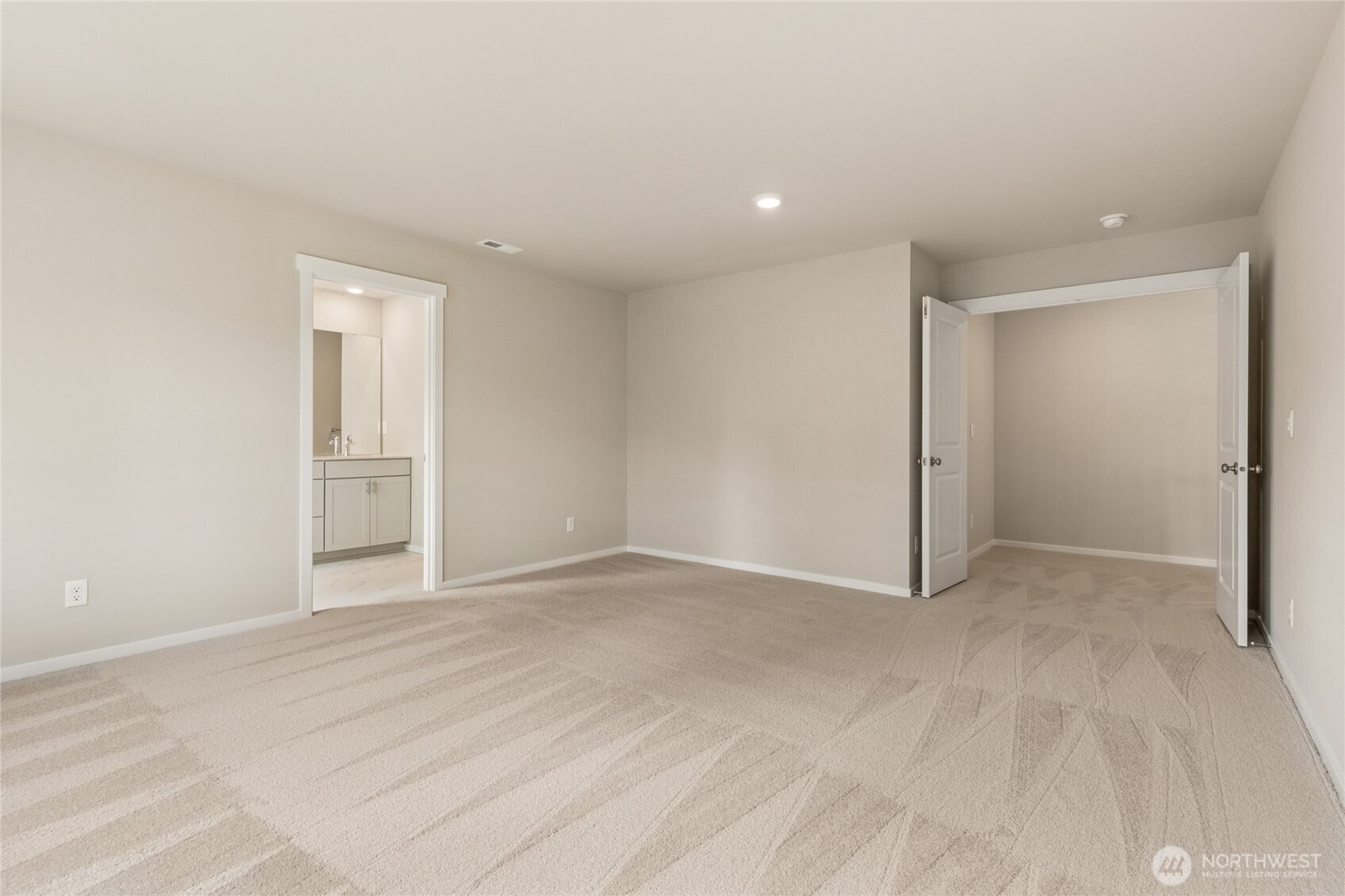 2241 Boxcar Court Northeast, Unit 162 Olympia, WA 98506 - Photo 18 of 21 a view of an empty room with wooden floor and closet