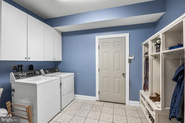 a bathroom with a toilet a sink and a mirror