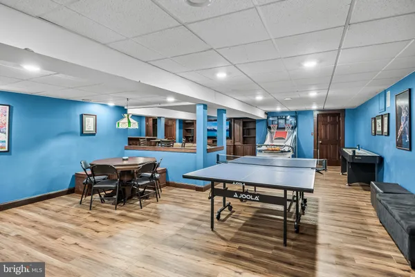 a room with furniture and wooden floor