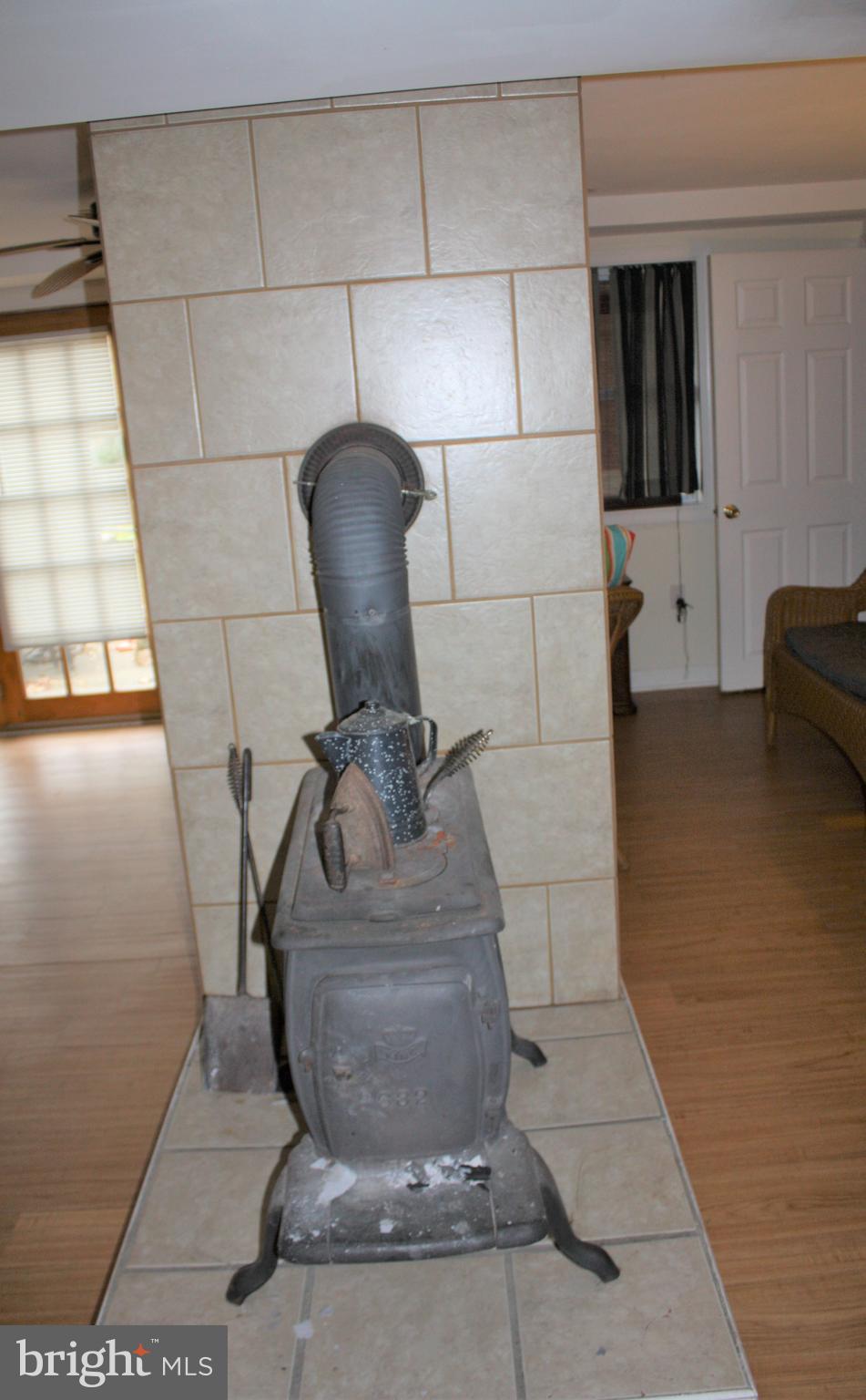 892 Walnut Shade Road Louisa, VA 23093 - Photo 25 of 37 Woodstove in basement