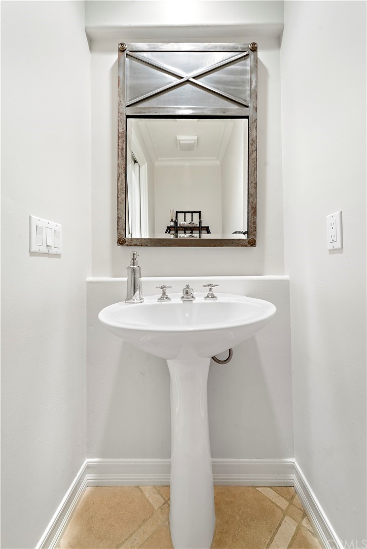1 Meryton Irvine, CA 92603 - Photo 19 of 42 a bathroom with a sink a vanity and a mirror