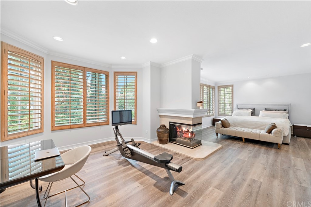 1 Meryton Irvine, CA 92603 - Photo 21 of 42 a living room with furniture and a wooden floor