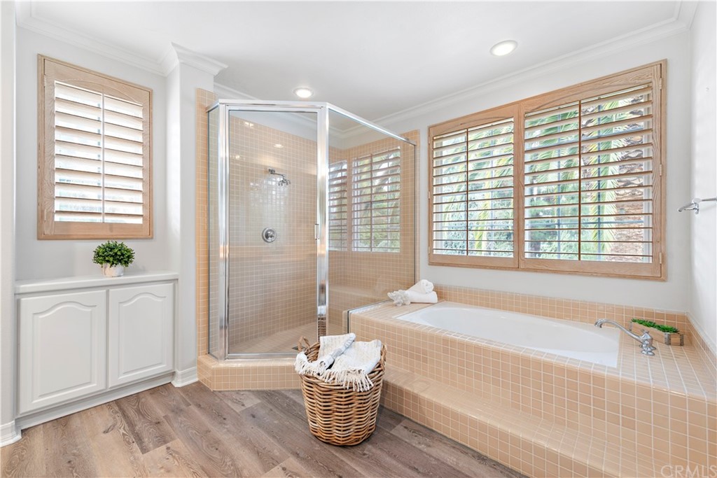 1 Meryton Irvine, CA 92603 - Photo 25 of 42 a spacious bathroom with a tub shower and window