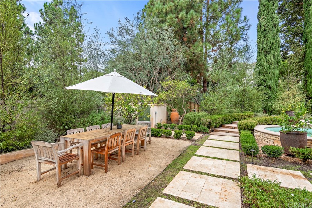 1 Meryton Irvine, CA 92603 - Photo 32 of 42 a view of a patio with a table and chairs under an umbrella