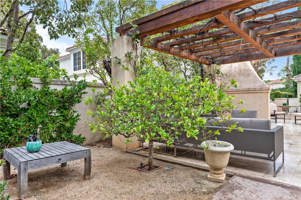 1 Meryton Irvine, CA 92603 - Photo 39 of 42 a backyard of a house with fountain plants and outdoor seating