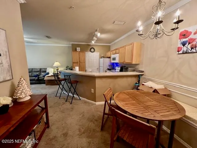 a view of a dining room with furniture