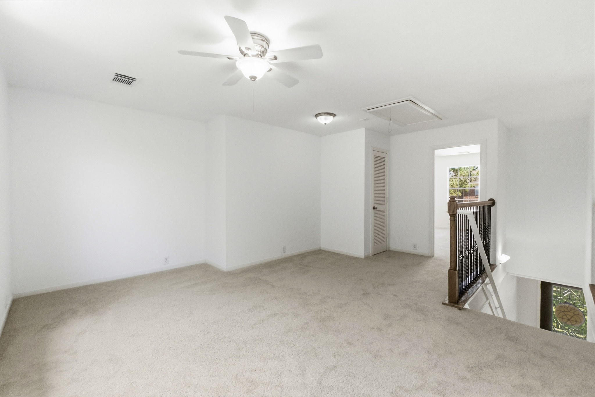 11907 Ezekiel Road Tomball, TX 77375 - Photo 21 of 39 an empty room with a ceiling fan and bathroom