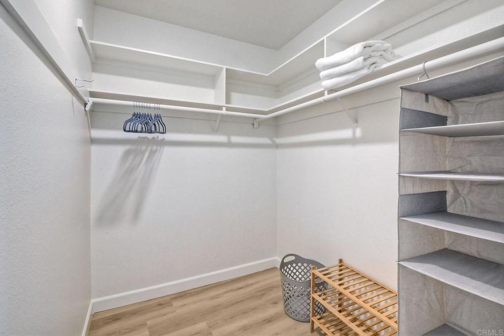 6675 Paseo Del Norte, Unit B Carlsbad, CA 92011 - Photo 13 of 19 a view of walk in closet with empty racks