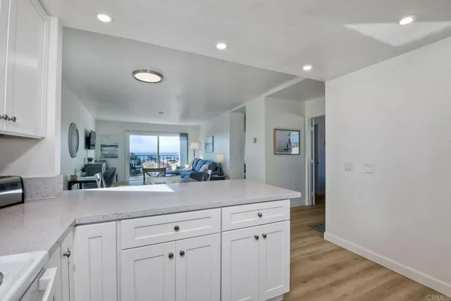 a view of a kitchen counter space cabinets and wooden floor