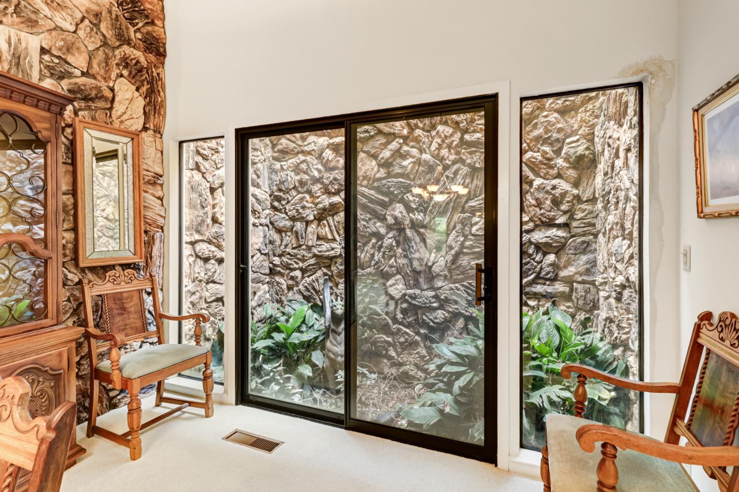 2812 Lacy Lane Sacramento, CA 95821 - Photo 40 of 76 Interior garden courtyard brings in sunlight to the dining room